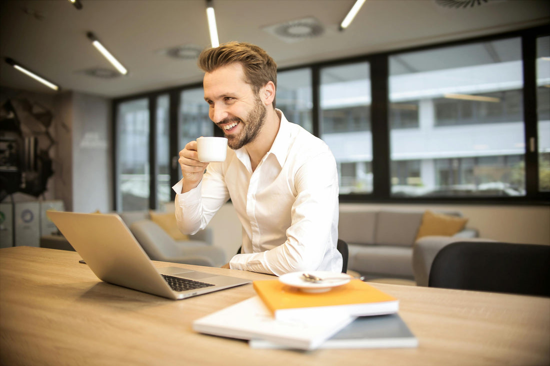 Man at laptop Selling Print-On-Demand Products and selling prints on amazon