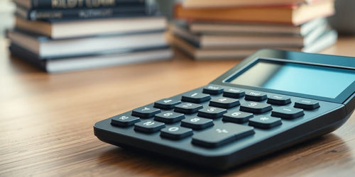 Modern calculator with books in a cozy workspace.