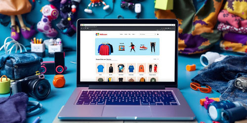 Dropshipping with AliExpress and Shopify. Laptop with online store and trendy products around it.